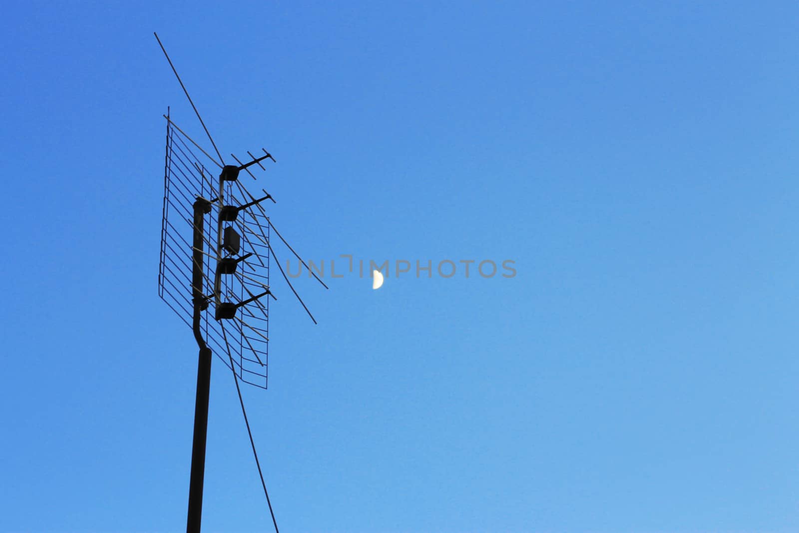 Television antenna for home TV in blue sky by scullery