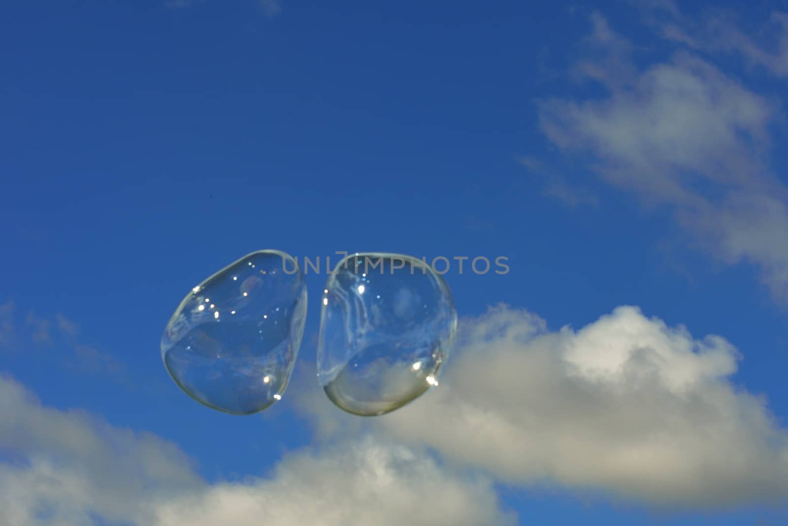 Pair of bubbles in sky by pauws99