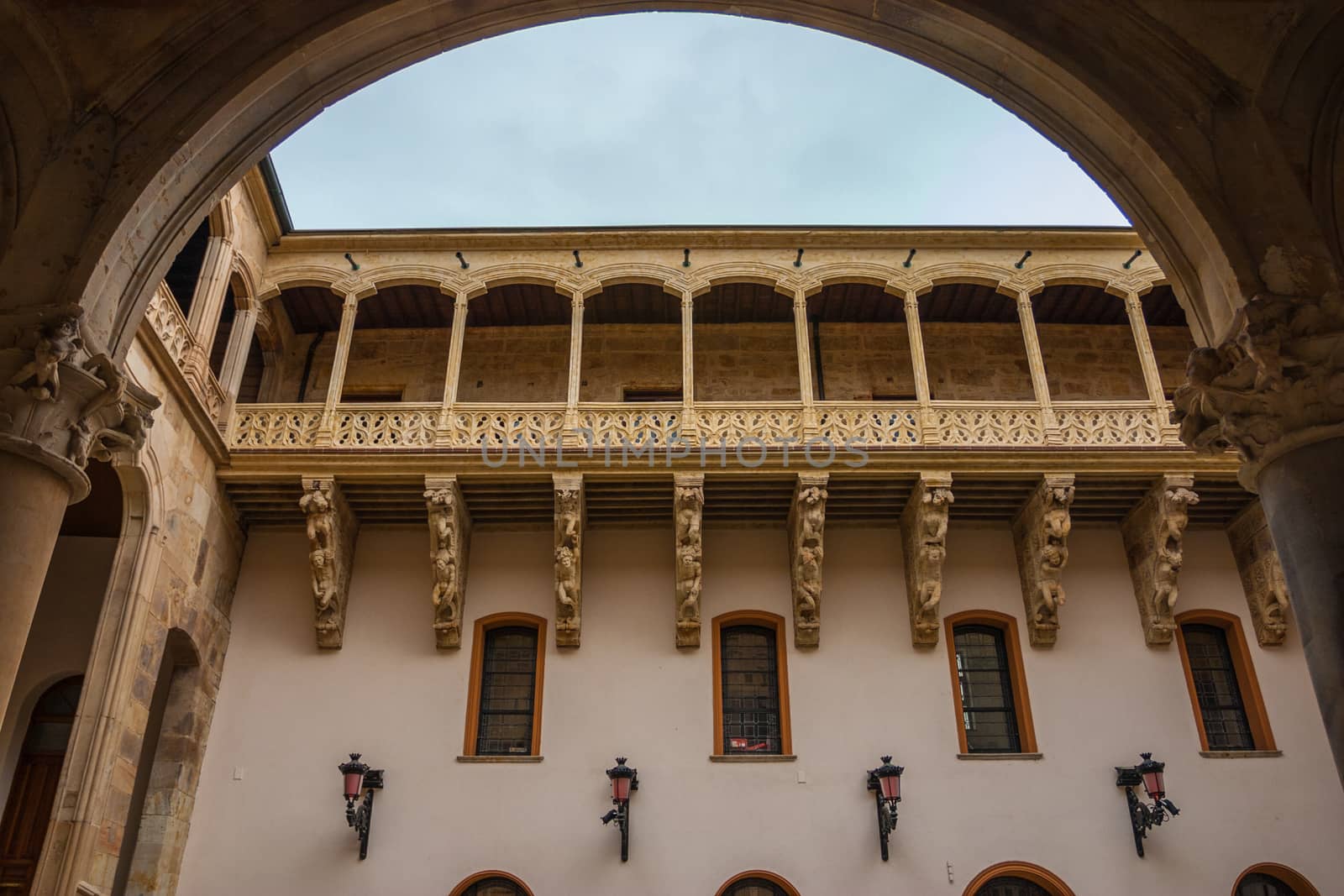 Full view of stone carved balcony in the courtyard of Salina Palace located in Salamanca
