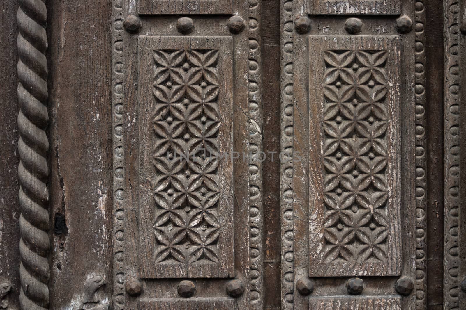 Delicate wooden carving in a old door