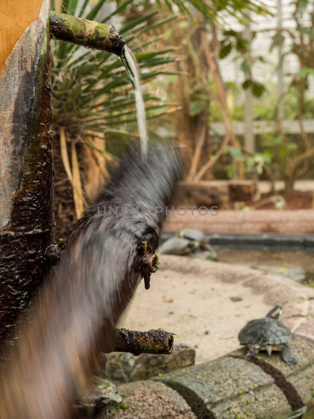 Water wheel caught in motion while spinning