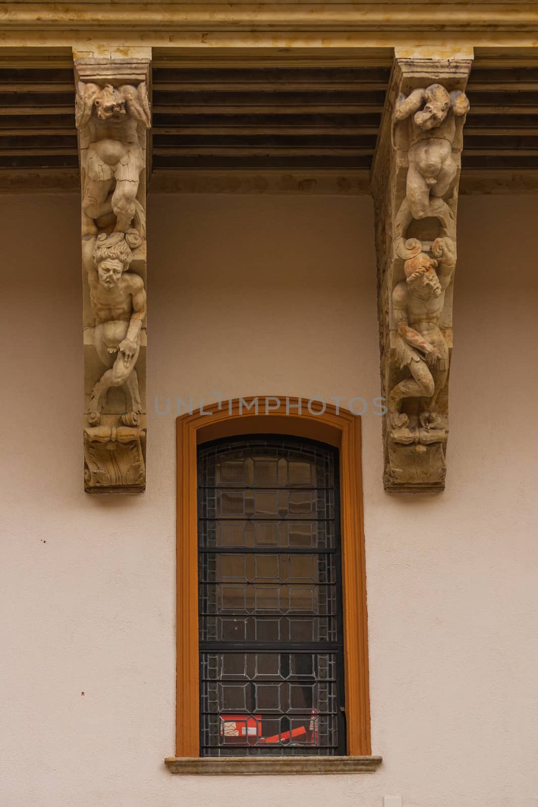 Twisted bodies  carved in the corbels of Salina Palace courtyard located in Salamanca Spain