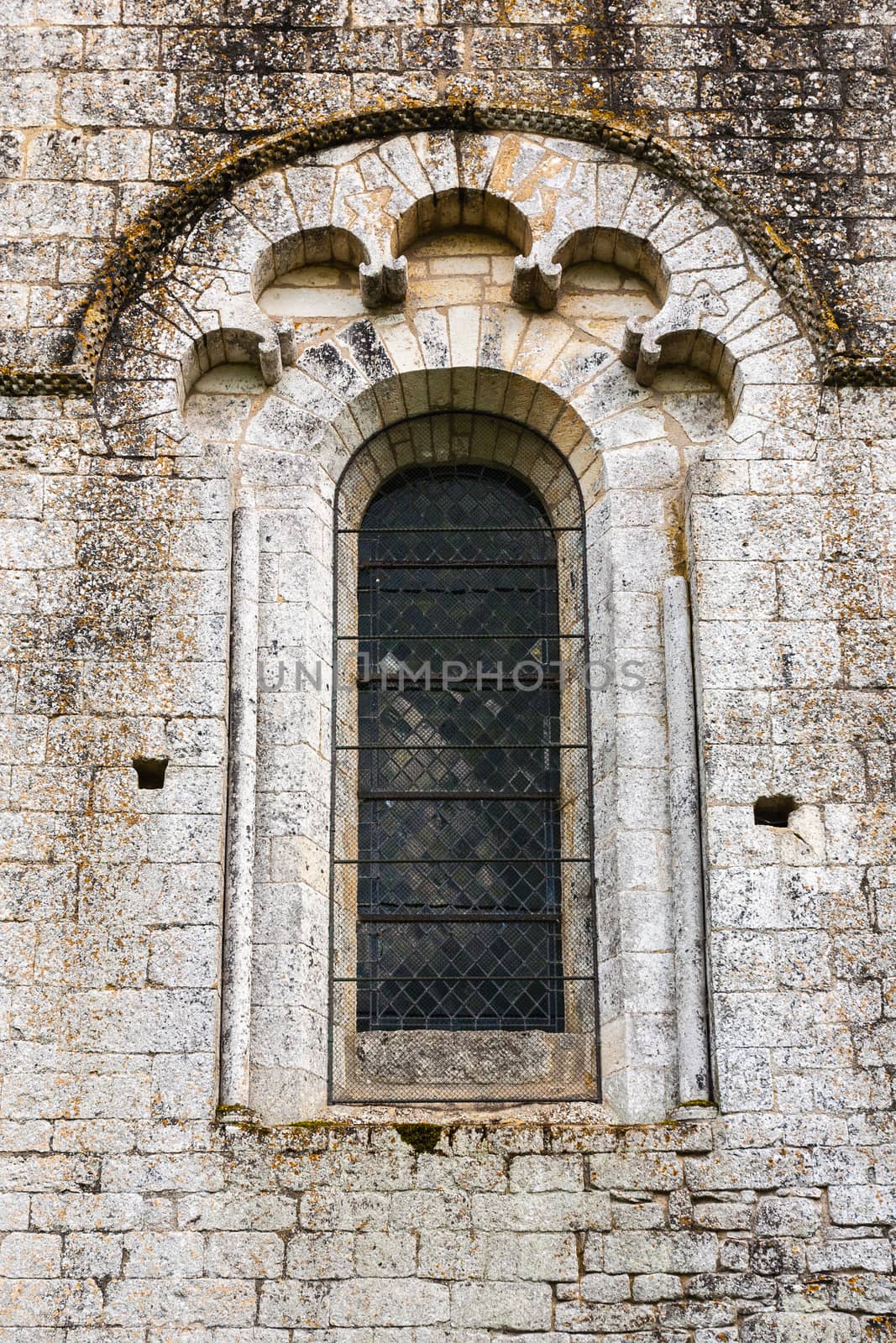 beautiful romanesque window in the romanesque fortified church of Saint Amand de Coly in Dordigne ,France