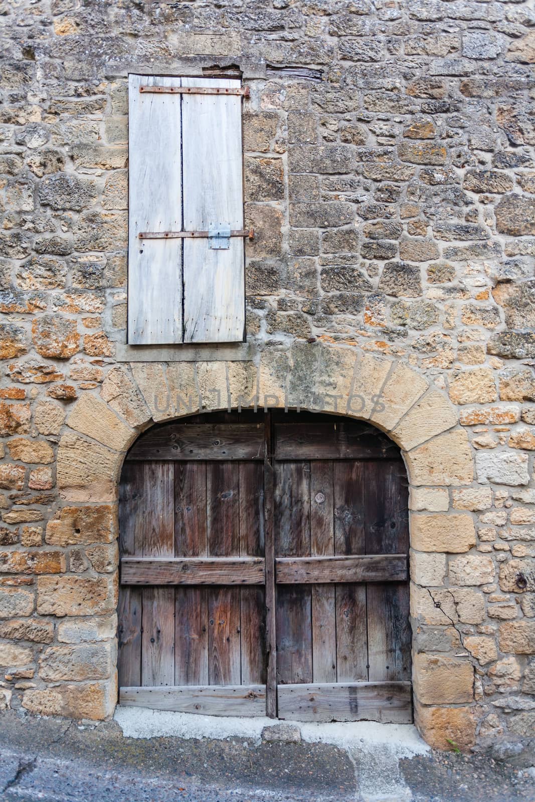 Closeup view of rural door and window in the french region of Dordogne