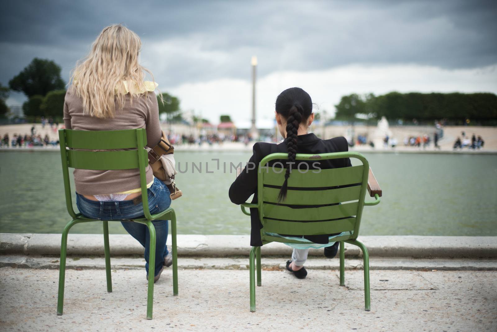 girls in Tuileries garden in Paris by NeydtStock