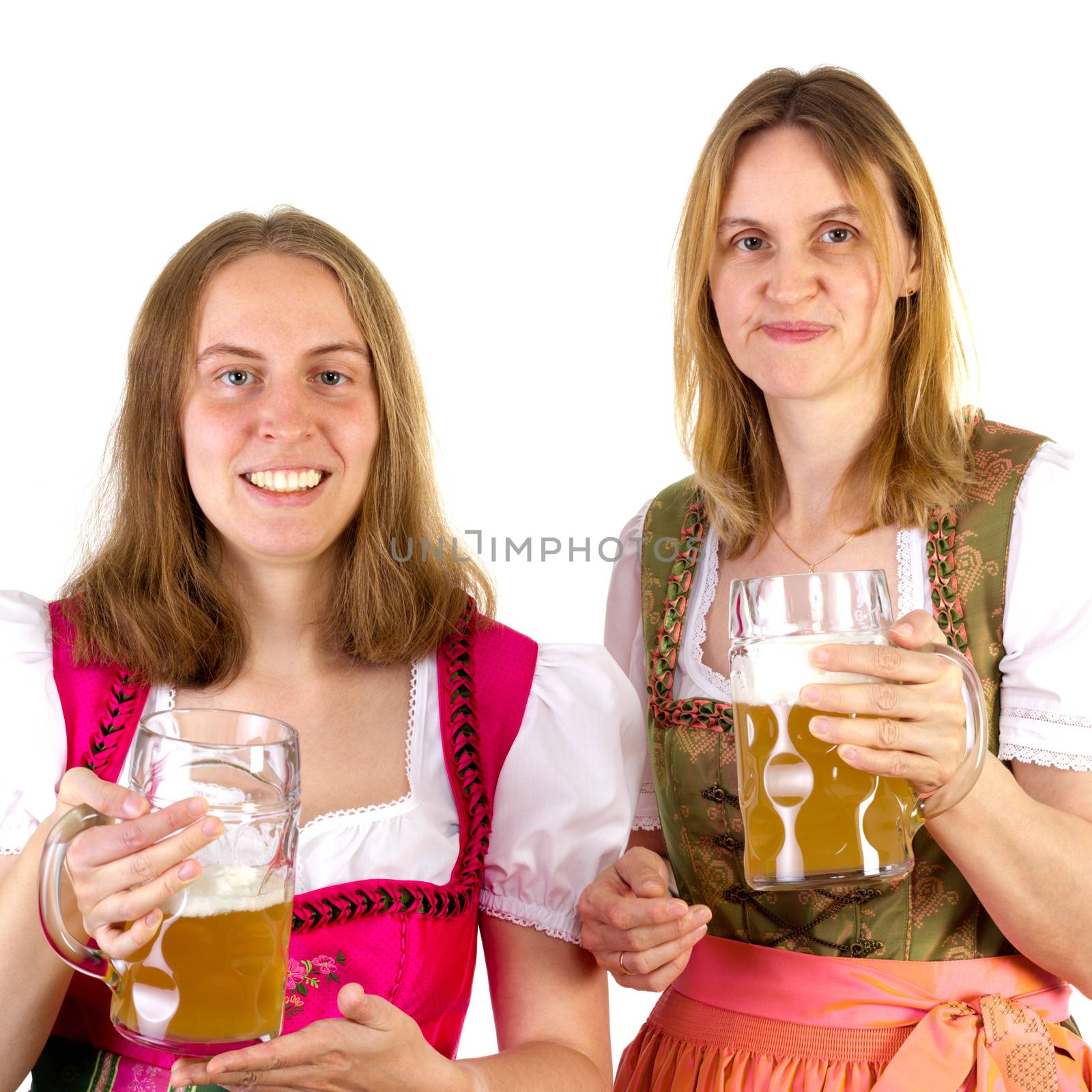 Women in dirndl presenting double beer by gwolters