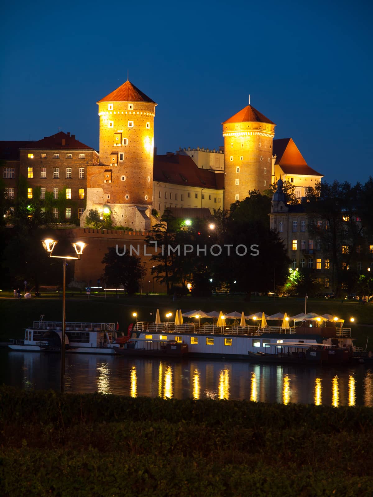 Wawel Castle and Vistula River in Krakow by night (Poland)