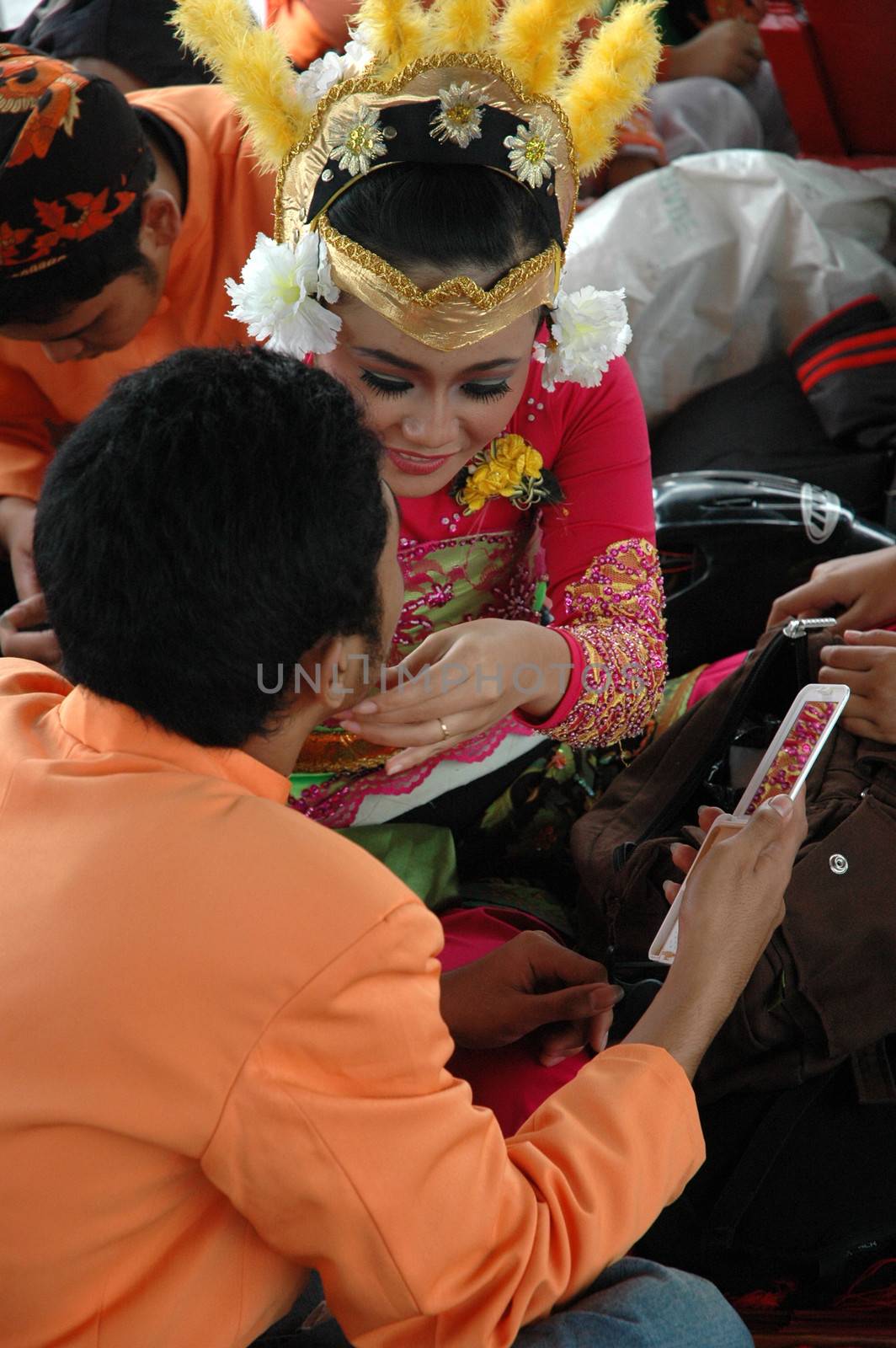 Bandung, Indonesia - March 9, 2008: Dancer member and musical crew gather together and make preparation before get performing on stage at Tegalega Park Bandung, West Java-Indonesia.