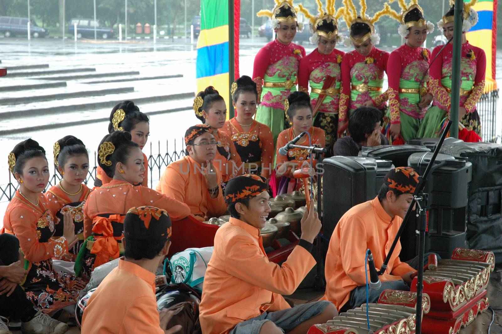 Bandung, Indonesia - March 9, 2008: Dancer member and musical crew gather together and make preparation before get performing on stage at Tegalega Park Bandung, West Java-Indonesia.