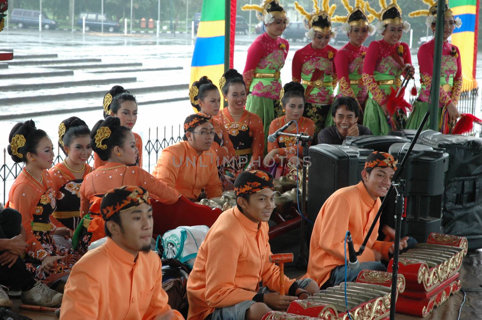 Bandung, Indonesia - March 9, 2008: Dancer member and musical crew gather together and make preparation before get performing on stage at Tegalega Park Bandung, West Java-Indonesia.