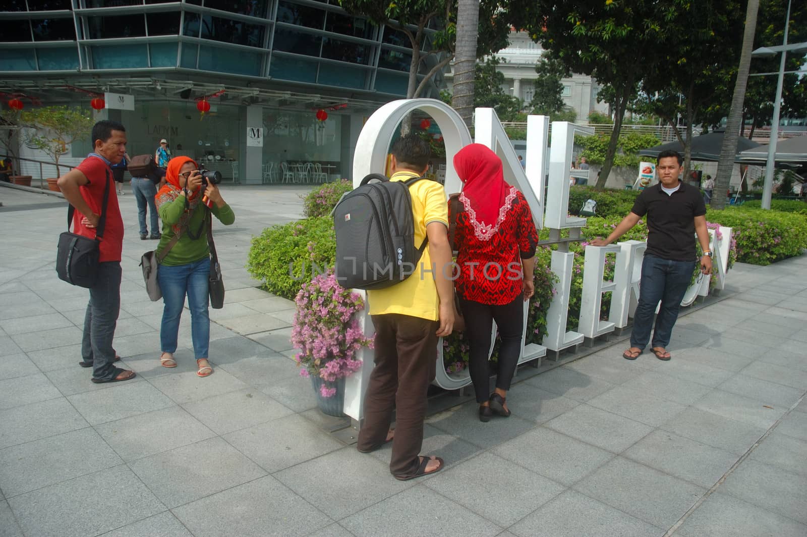 Singapore, Singapore - January 18, 2014: Group of tourist that visiting Merlion Park Singapore.