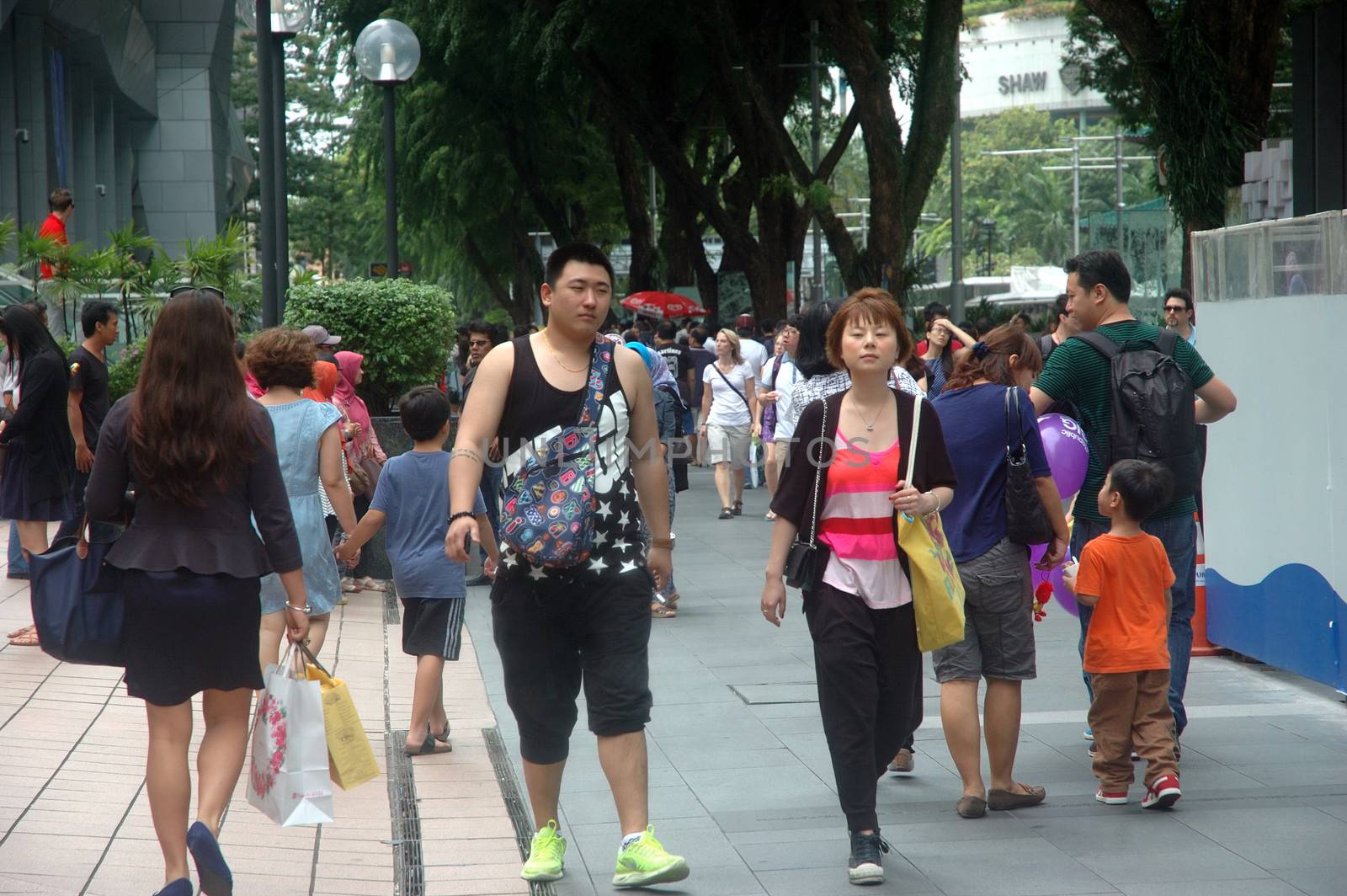 Singapore, Singapore - January 18, 2014: People crowd at Orchard road Singapore.