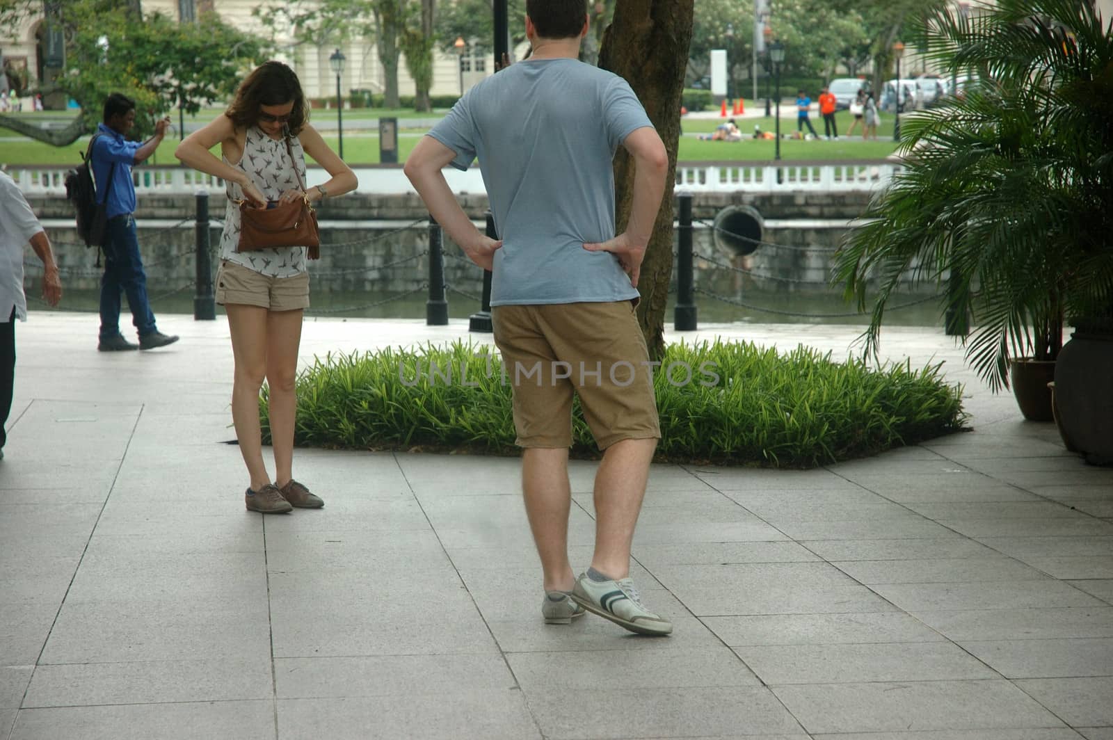 Singapore, Singapore - April 14, 2013: People crowd at One Fullerton, Singapore.