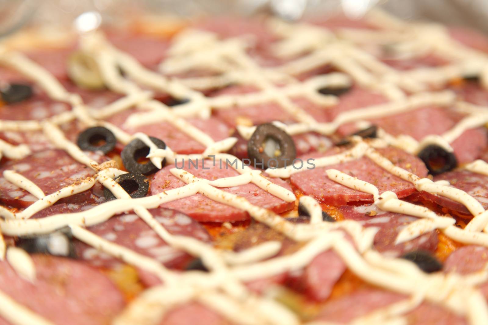 A large pizza with salami closeup