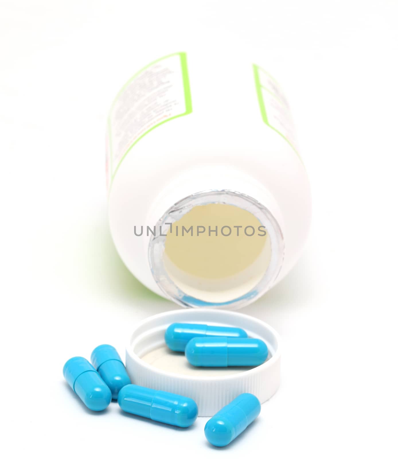 blue pills and packing on a white background