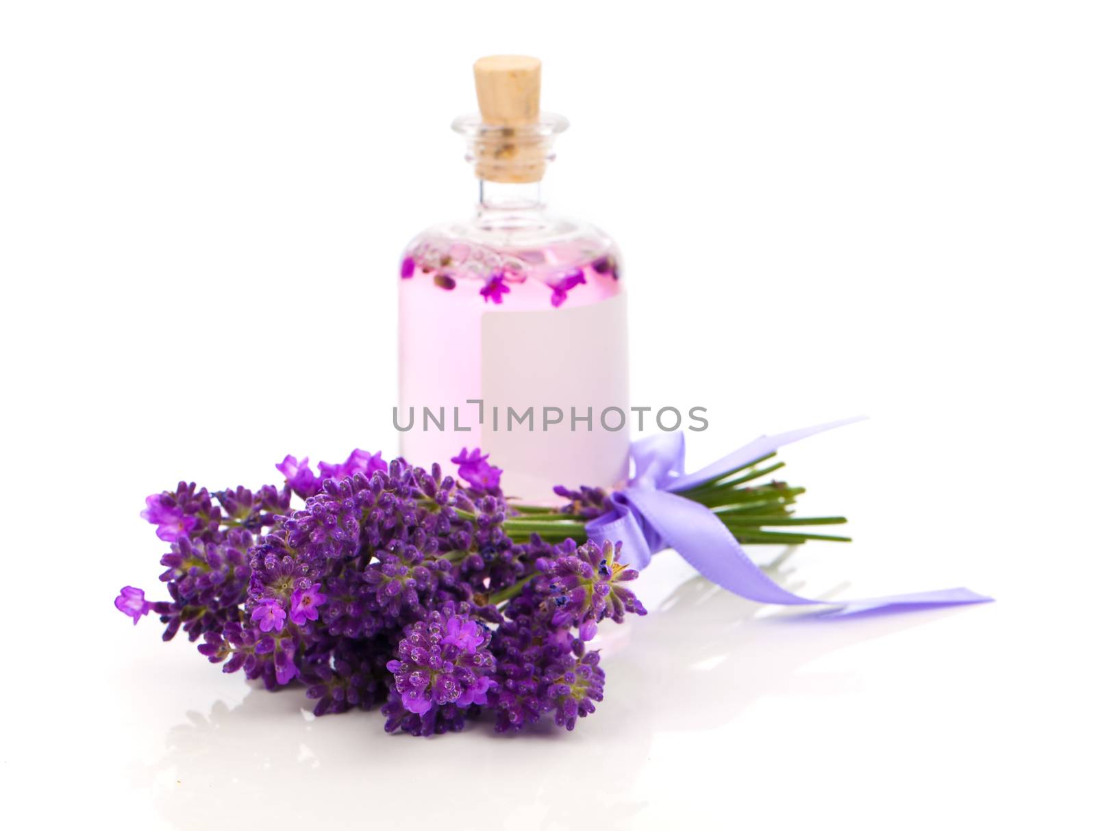 fresh lavender blossoms with Natural handmade lavender oil, on white background