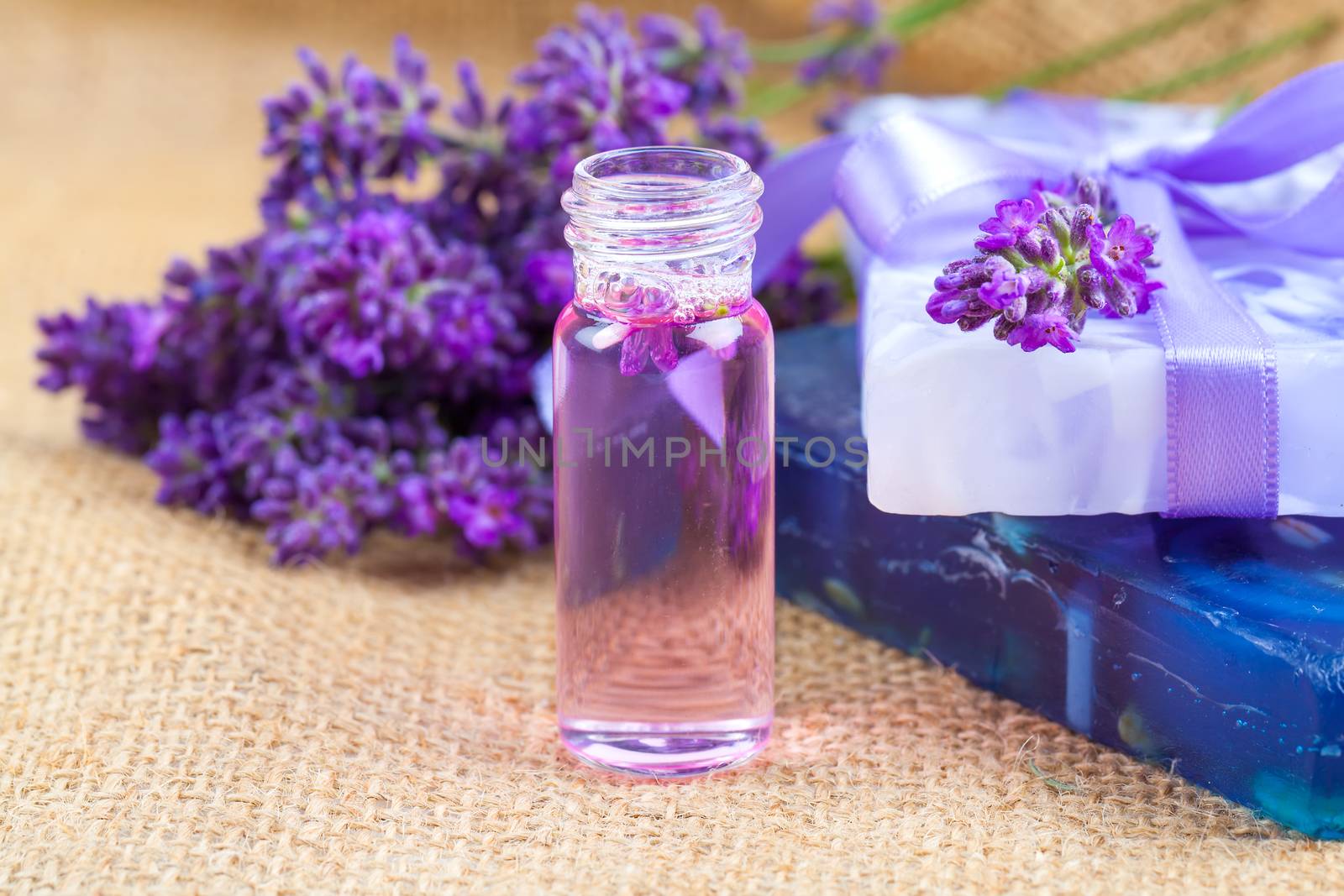 Natural handmade lavender Liquid soap and solid soap with fresh lavender flowers, on sackcloth