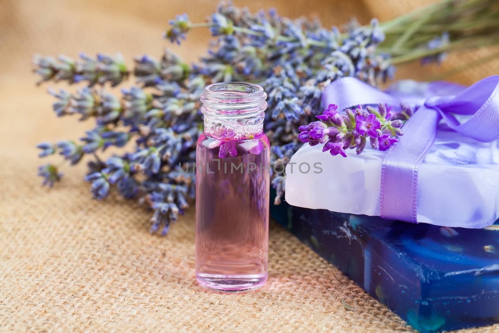 Natural handmade lavender Liquid soap and solid soap with fresh lavender flowers, on sackcloth
