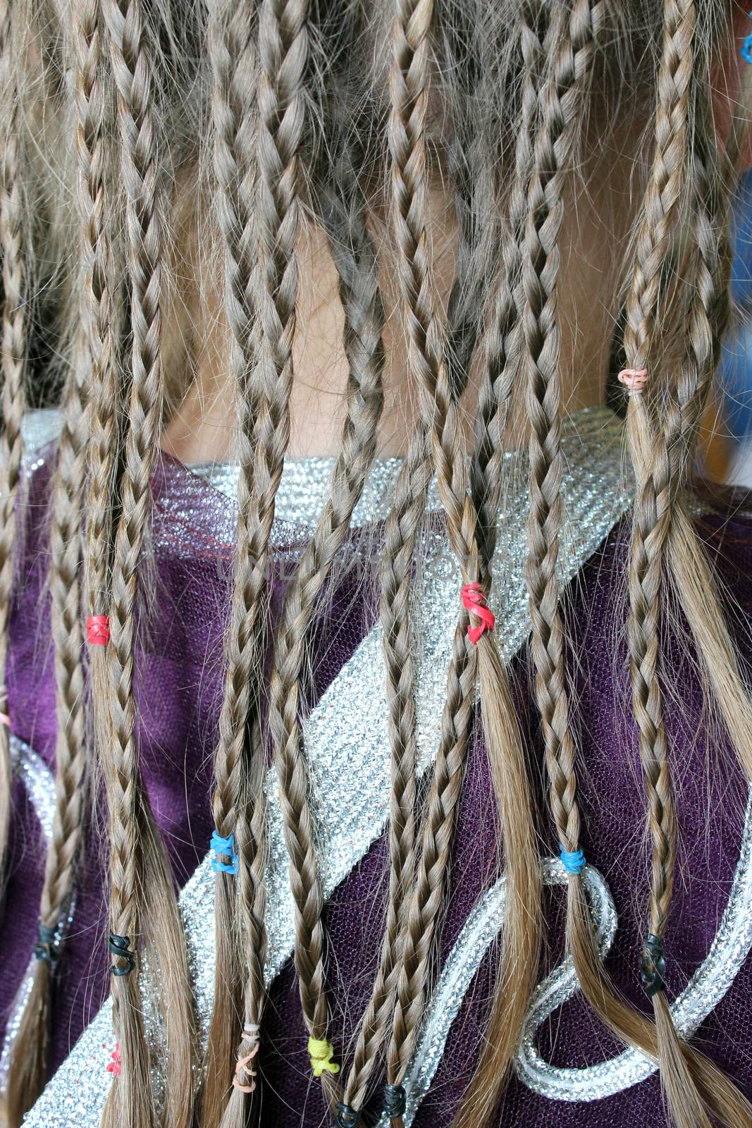 girl's plaits on the fabric pattern of suit by alexmak