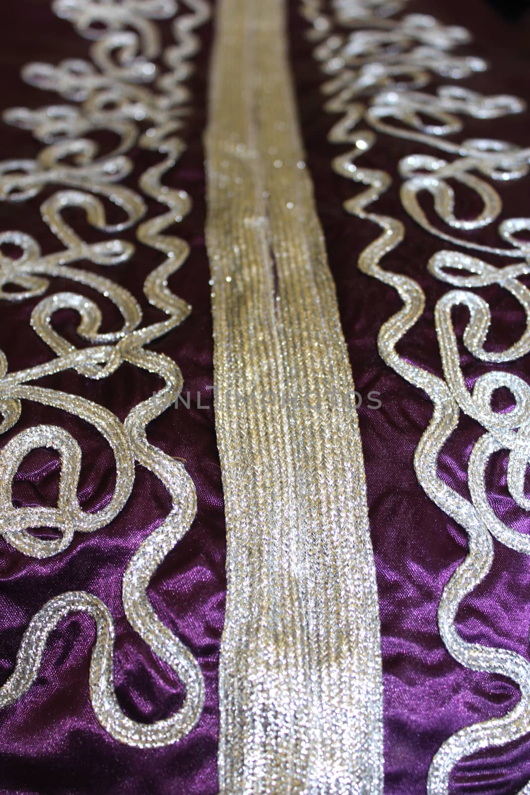 fabric pattern on the violet Moroccan suit