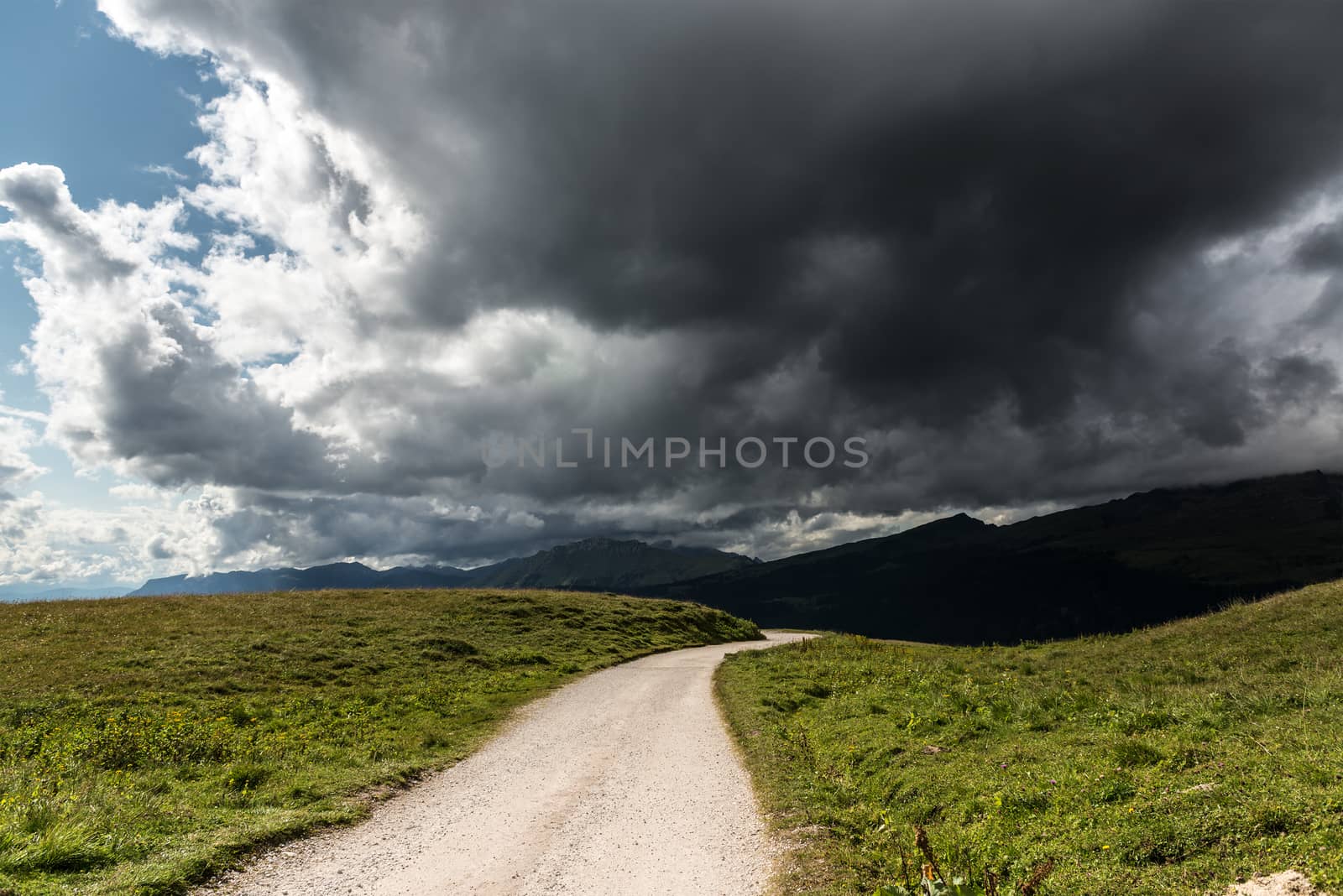 storm cloud over the mountain trail in the dolomites, Italy