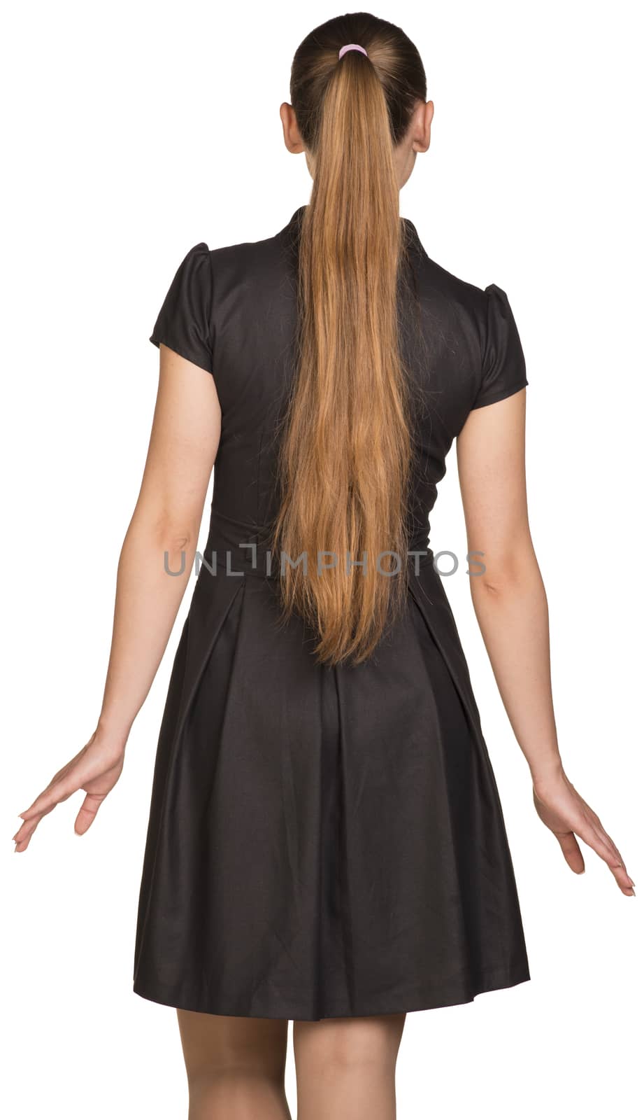 Attractive young woman in black dress. Rear view. Isolated on white