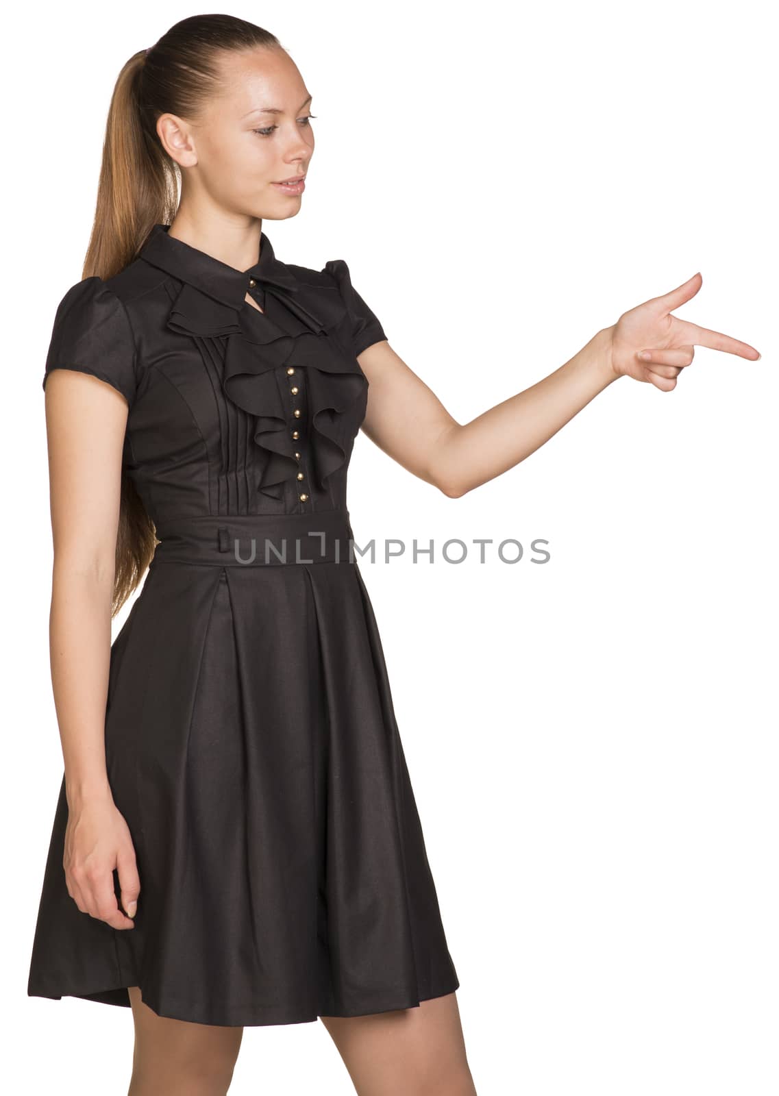Beautiful business woman in black dress pointing at copy space over white background