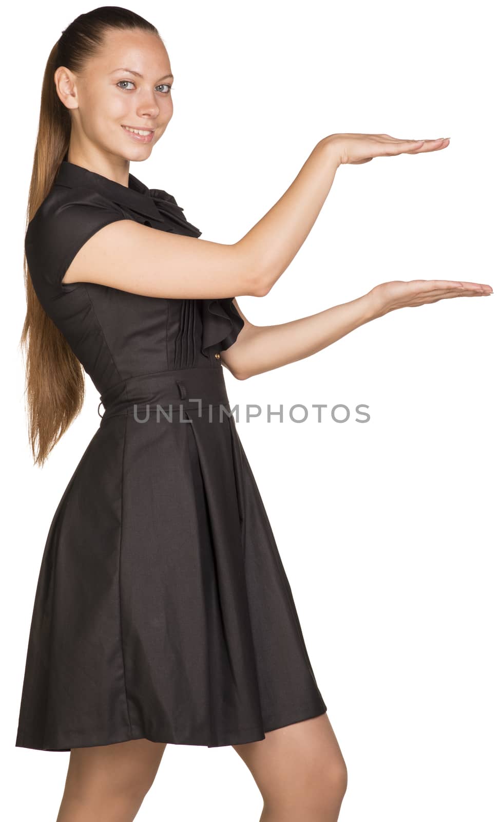 Young beautiful happy woman holding small imaginary object between two hands. Isolated