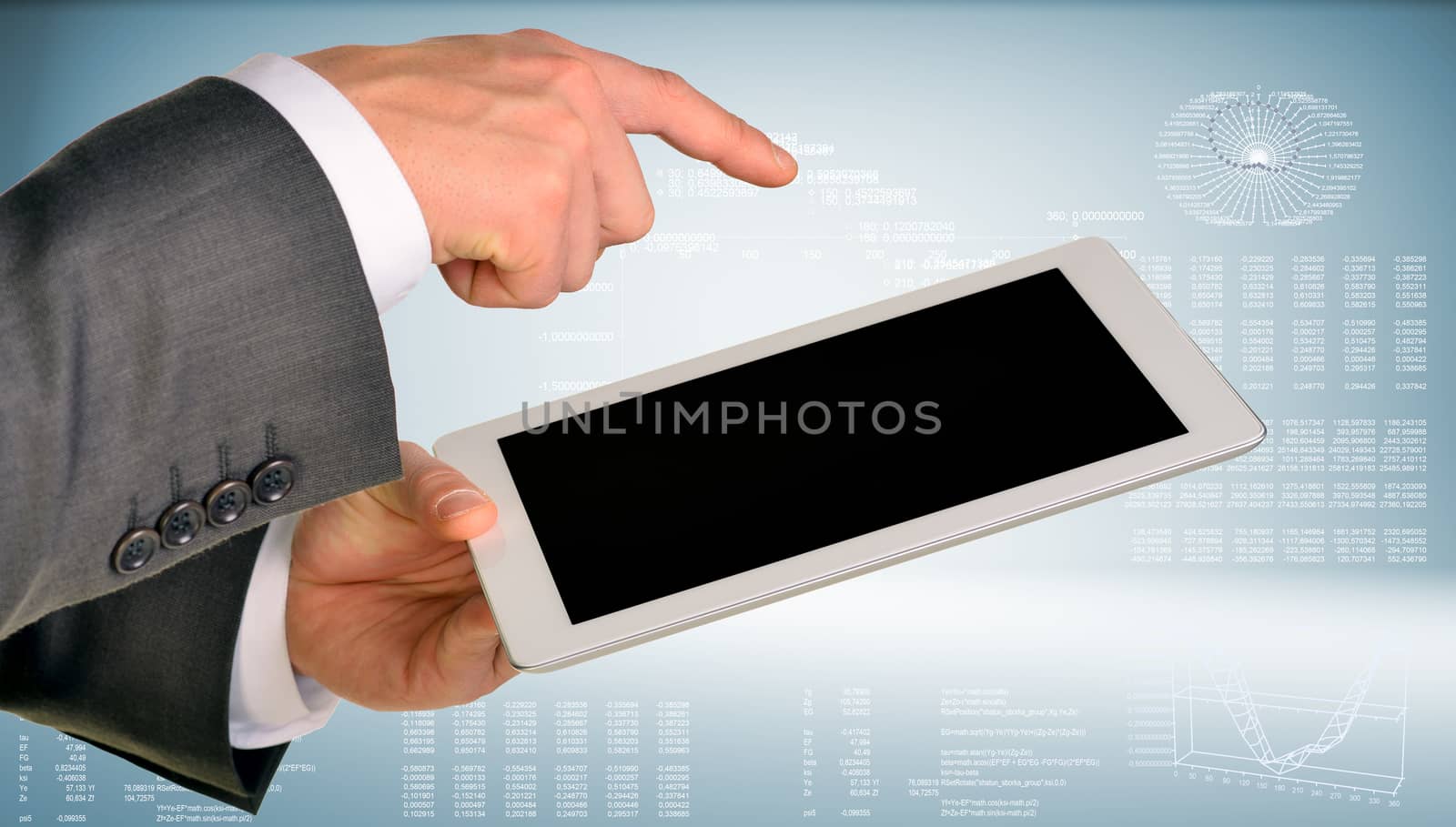 Businessman hand using tablet computer by cherezoff