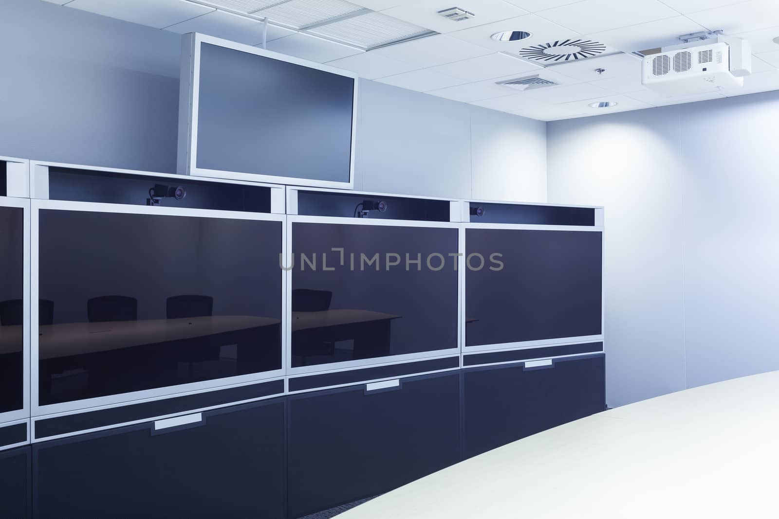 teleconferencing, video conference and telepresence screen display monitor in business meeting room