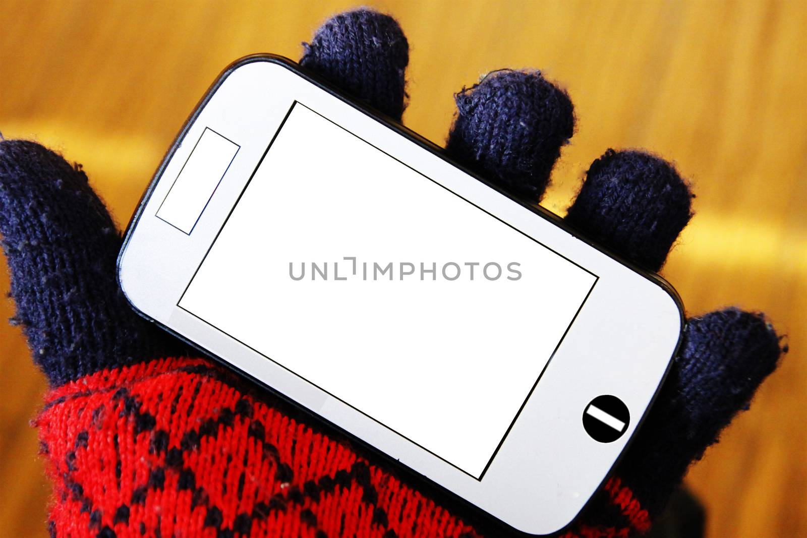 Hand with red glove holding the smart phone