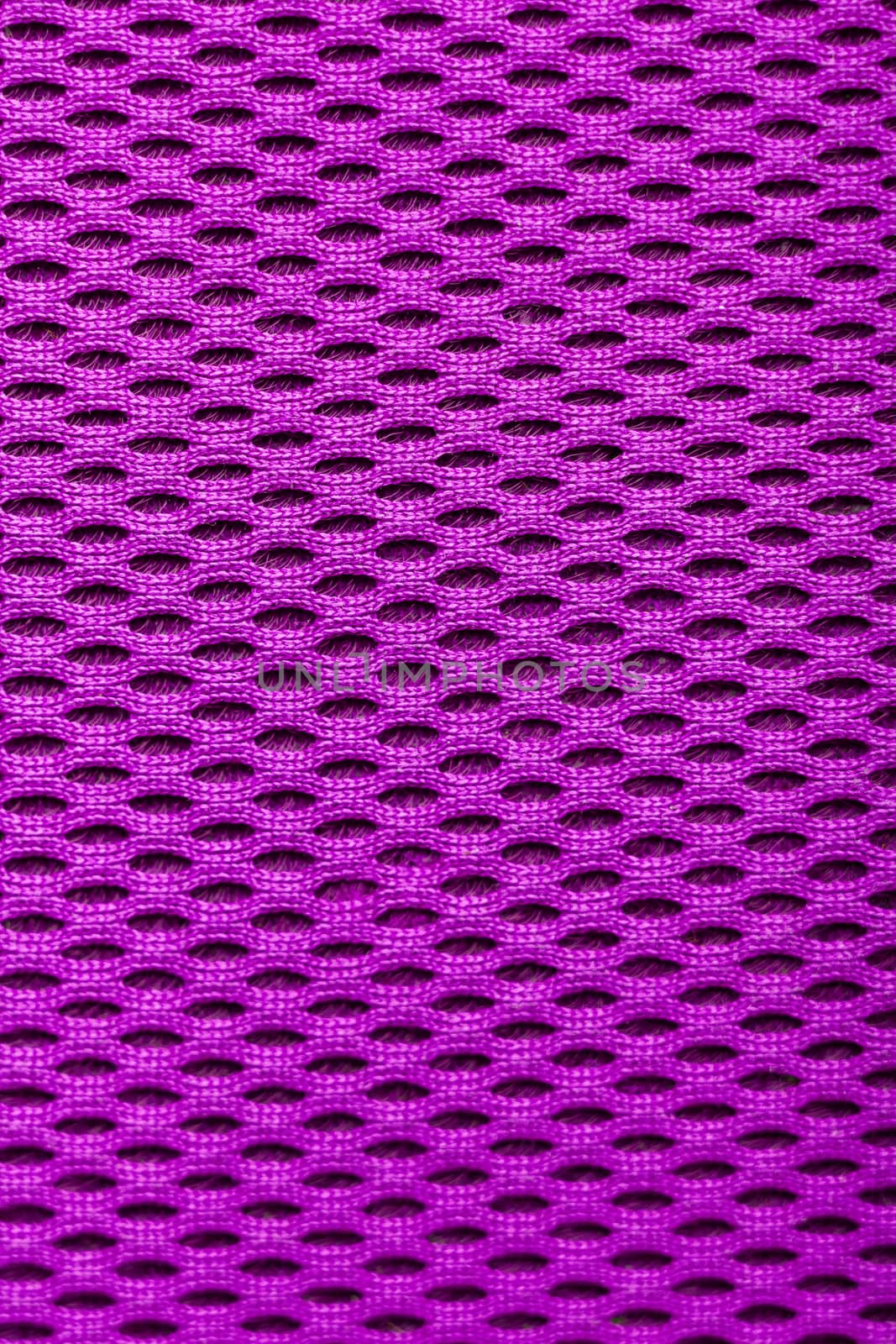 synthetic magenta cloth. grid closeup. macro. photo