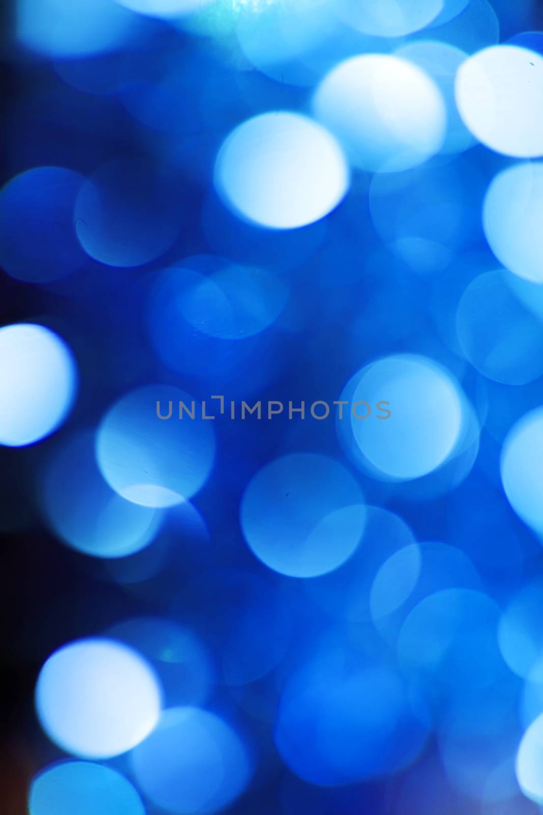 Abstract christmas background. Holiday colored lights unfocused