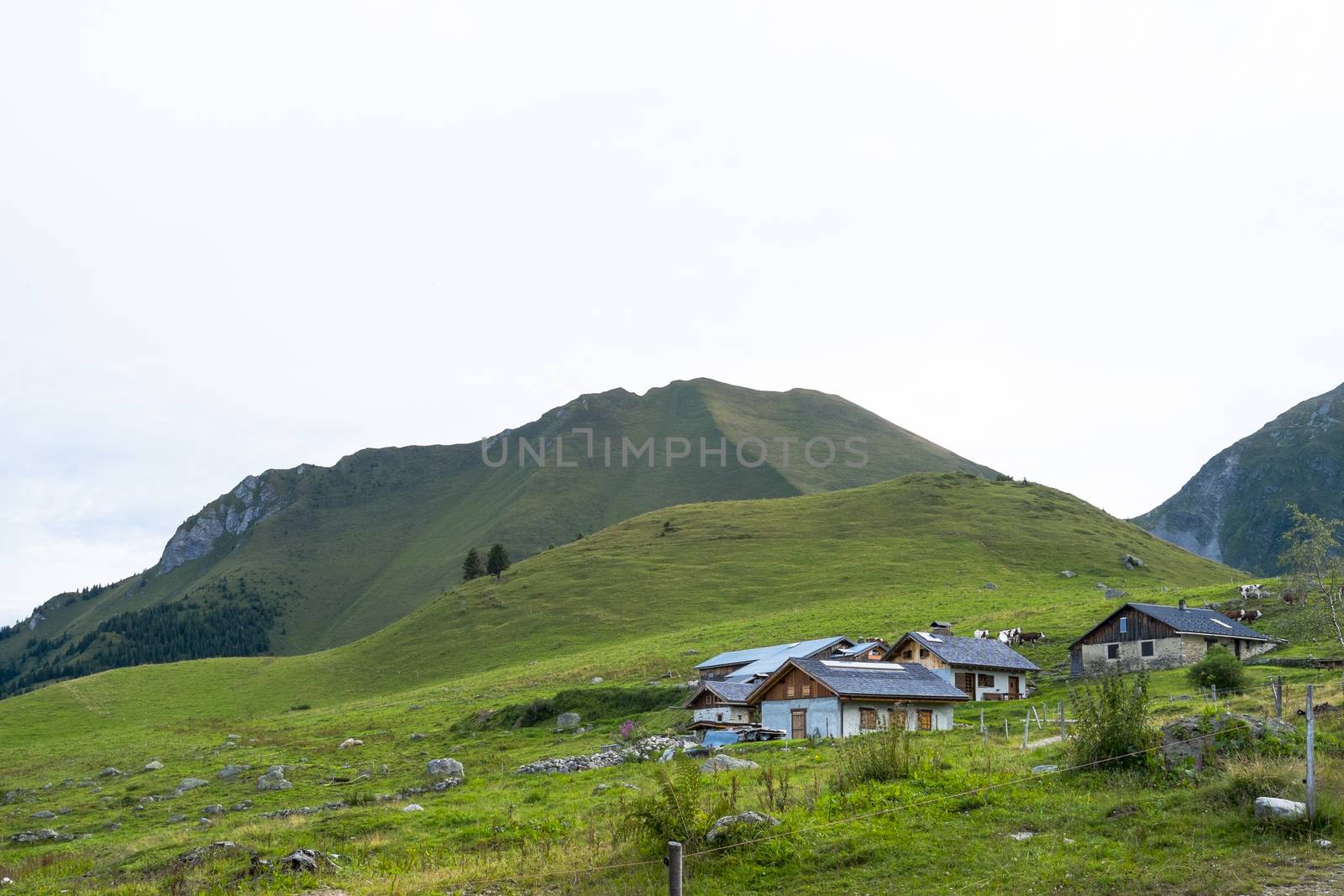 ST-GERVAIS-LES-BAINS, FRANCE - AUGUST 25: Refuge du Truc with Truc mountain in the background. This is one of the stages of the Mont Blanc Tour August 25, 2014 in St-Gervais-les-Bains.