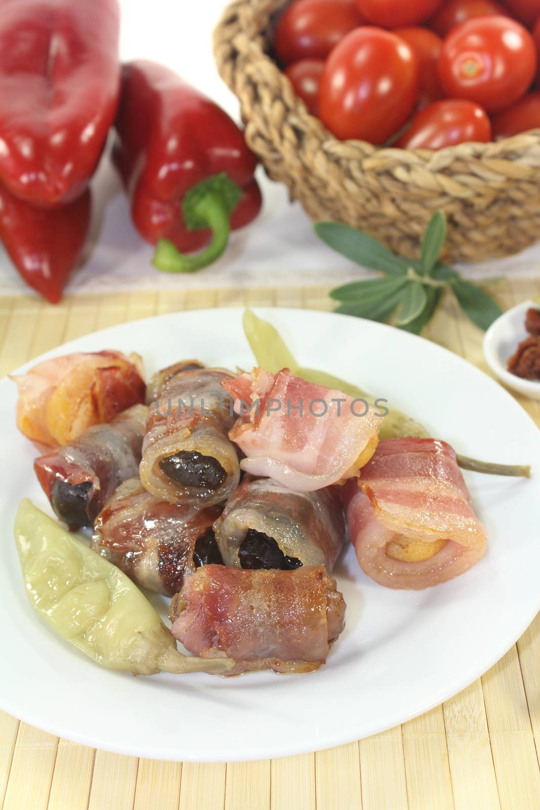 Tapas stuffed with prunes, figs and apricots on a light background