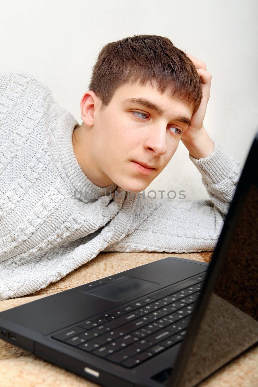 Teenager with Laptop by sabphoto