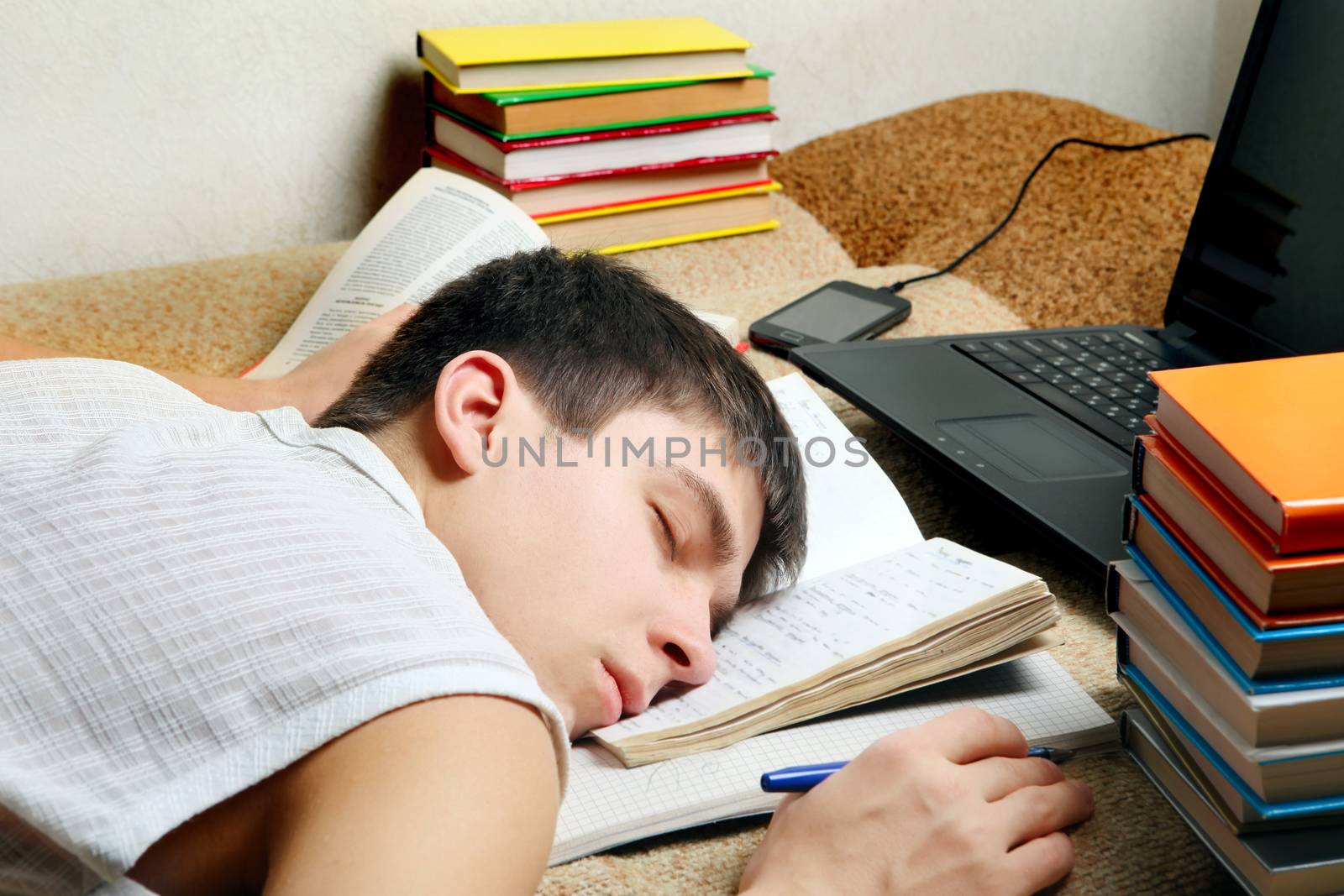 Tired Student sleeping by sabphoto