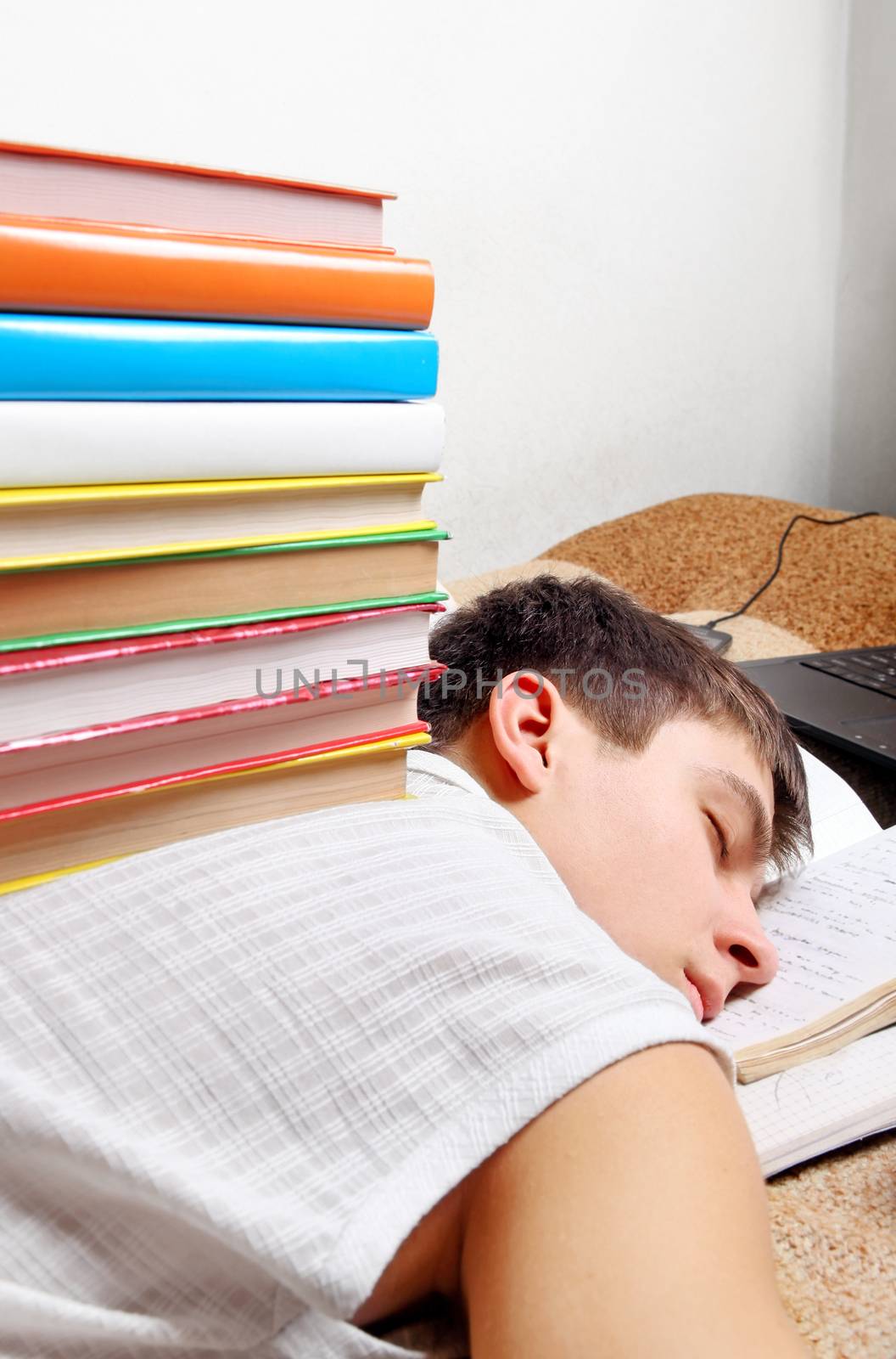 Tired Student sleeping by sabphoto