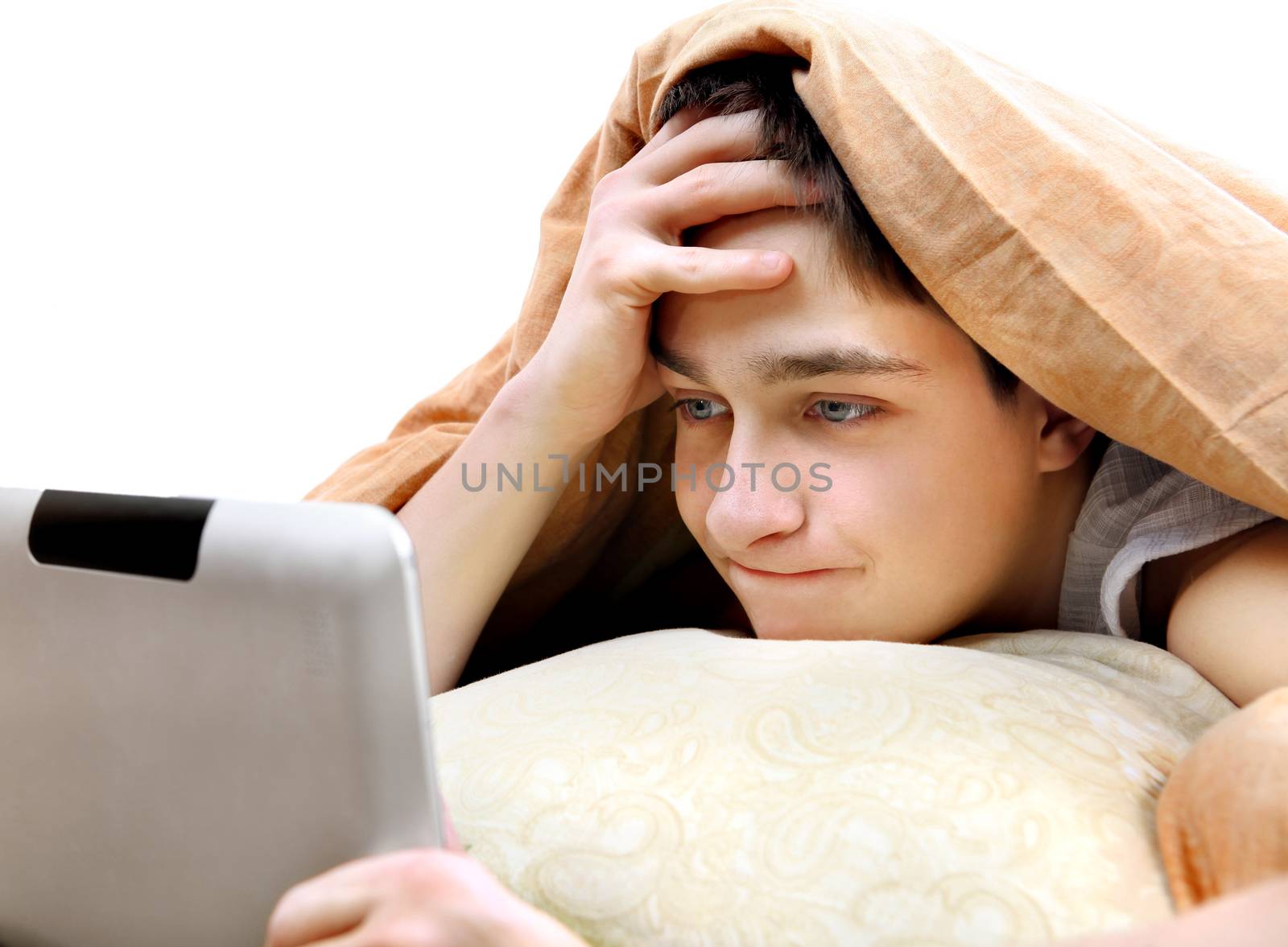 Teenager with Tablet in the Bed by sabphoto