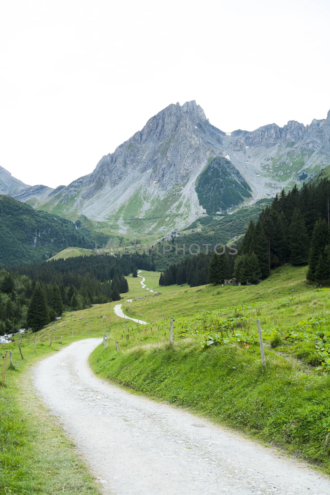 French countryside road with Pennaz Needles in the background