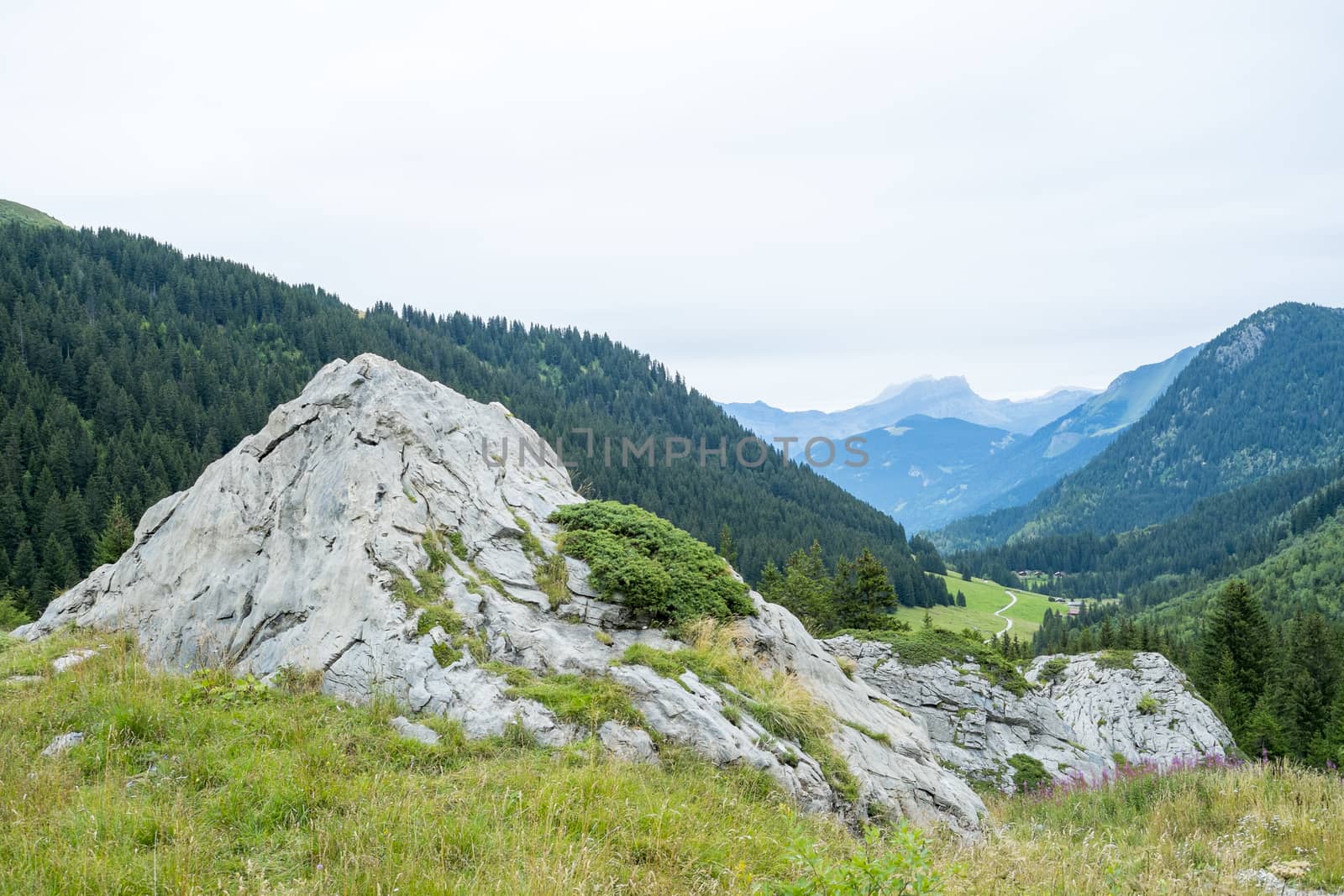 Bolder with La Rollaz valley in the background, one of the stages in the Mont Blanc Tour.