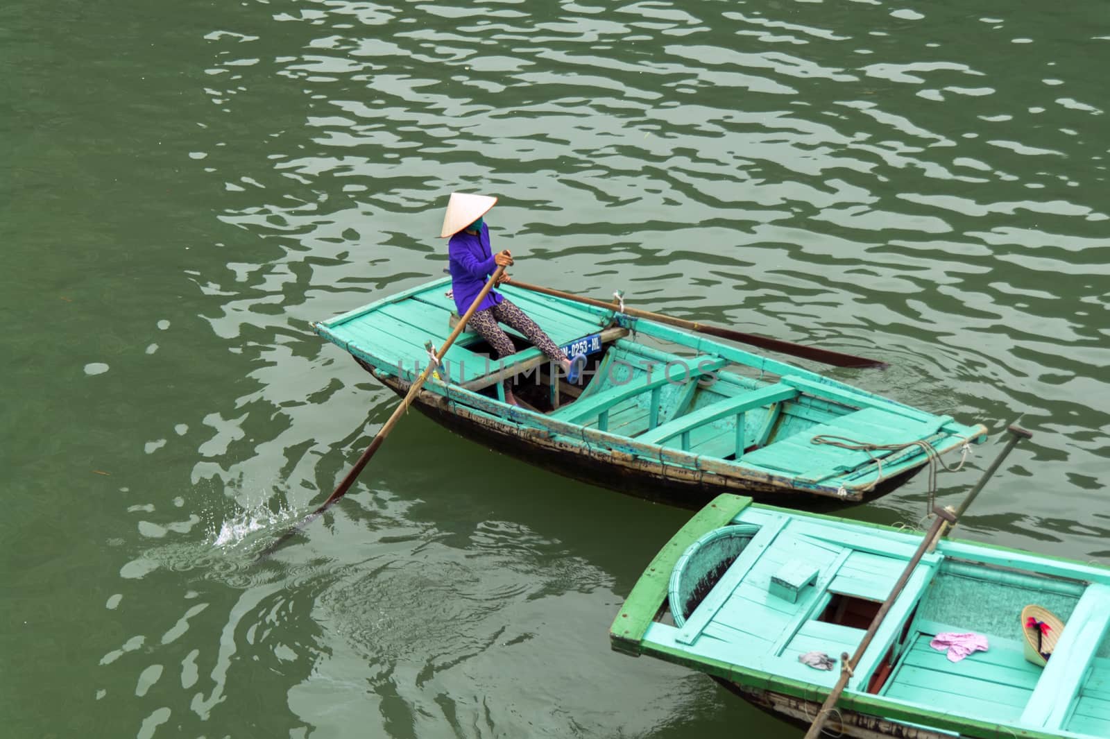 Vietnamese Rowing Boat in Ha Long Bay, Vietnam. EDITORIAL