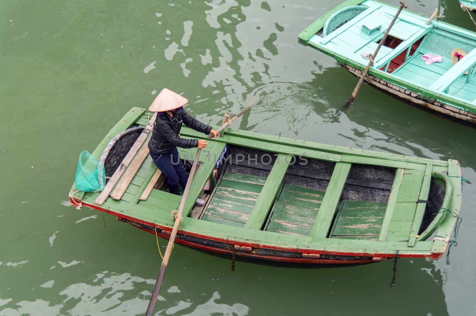 Vietnamese Rowing Boats in Ha Long Bay, Vietnam. EDITORIAL