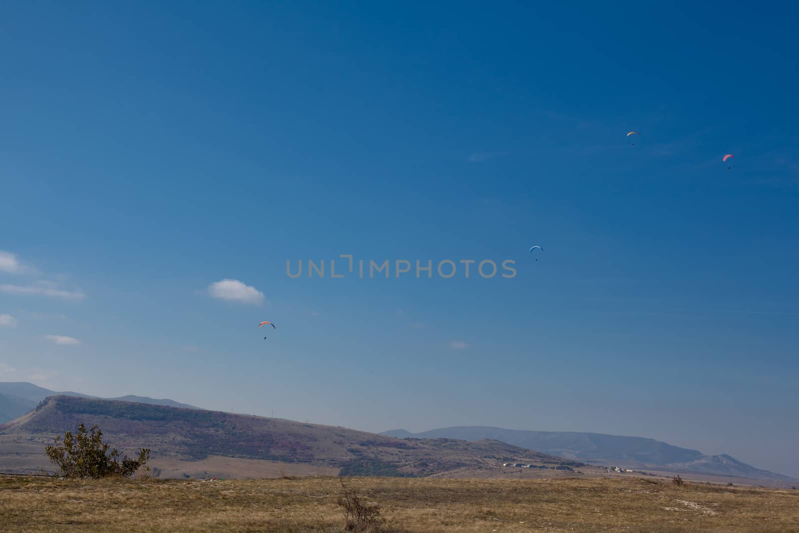Several flying paparlanes over Klementyev hill in Crimea
