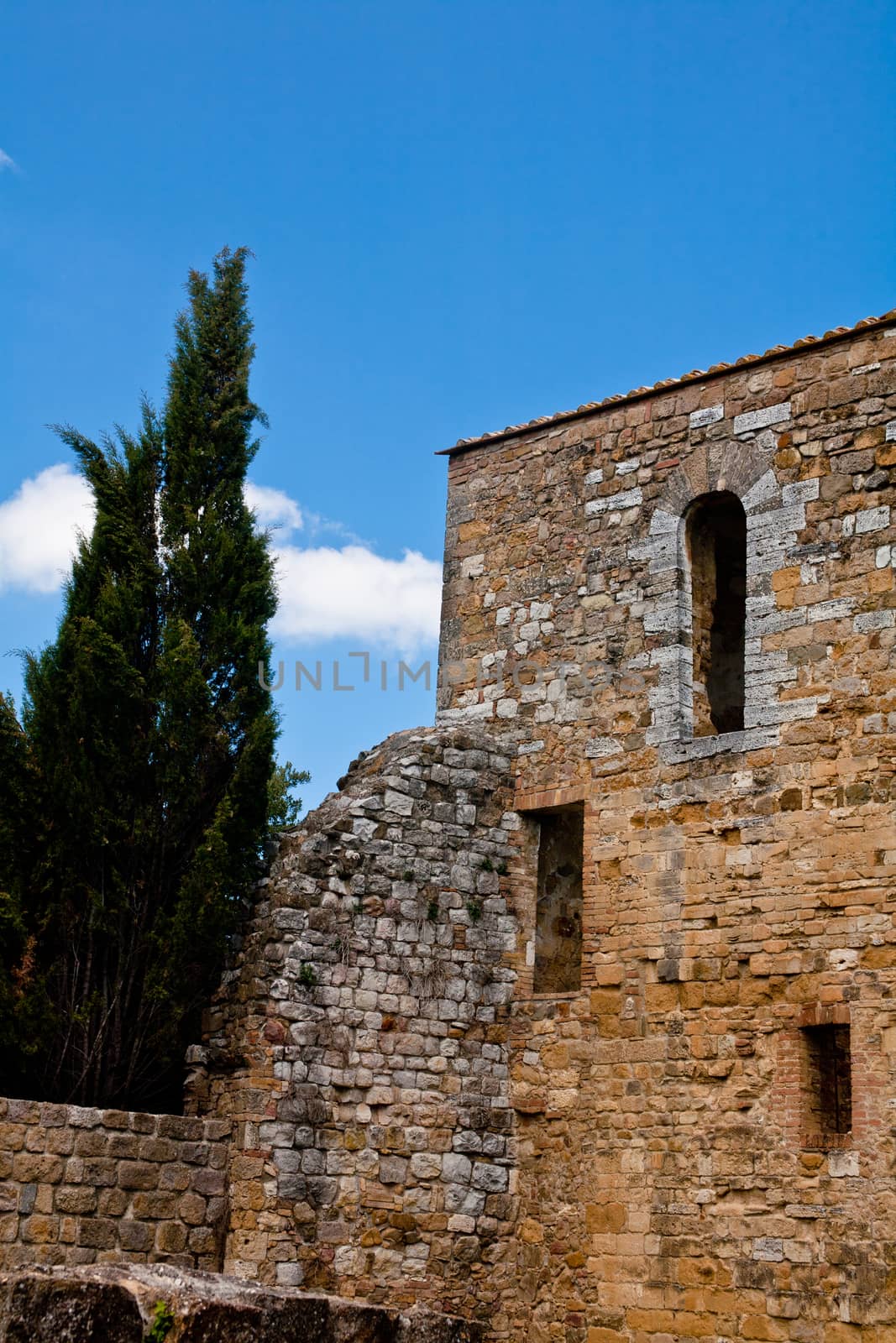 An old medieval building and ruins in San Quirico d'Orcia
