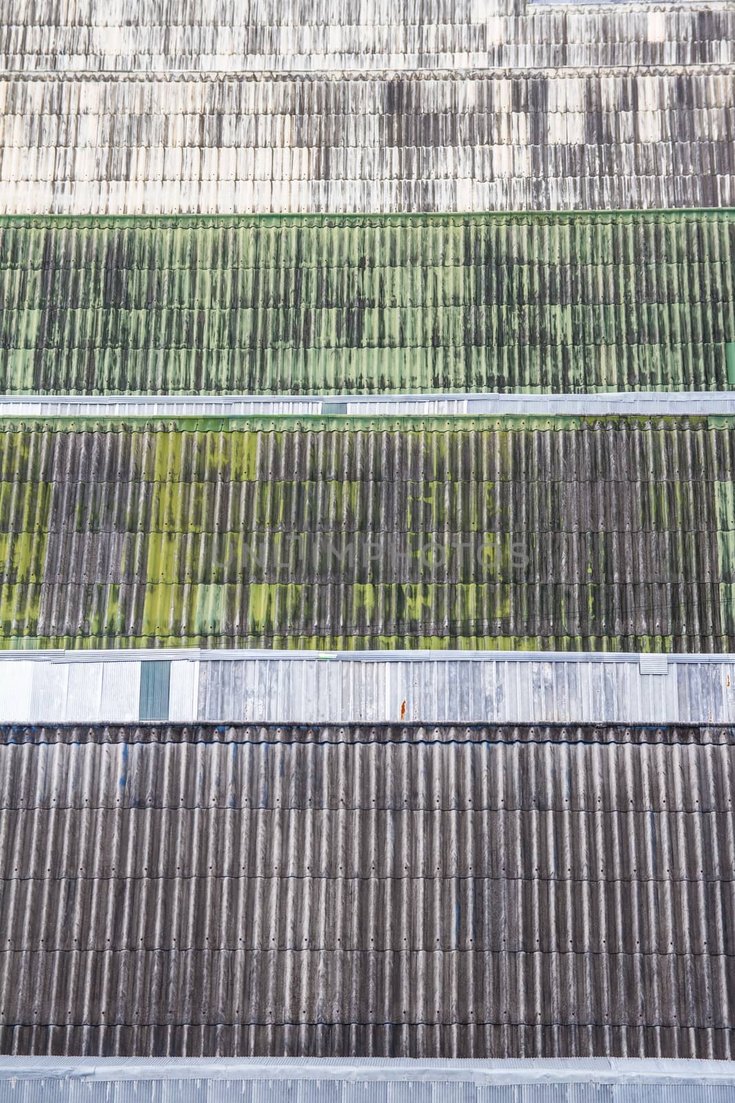 Top view of multiple old roofs tiles