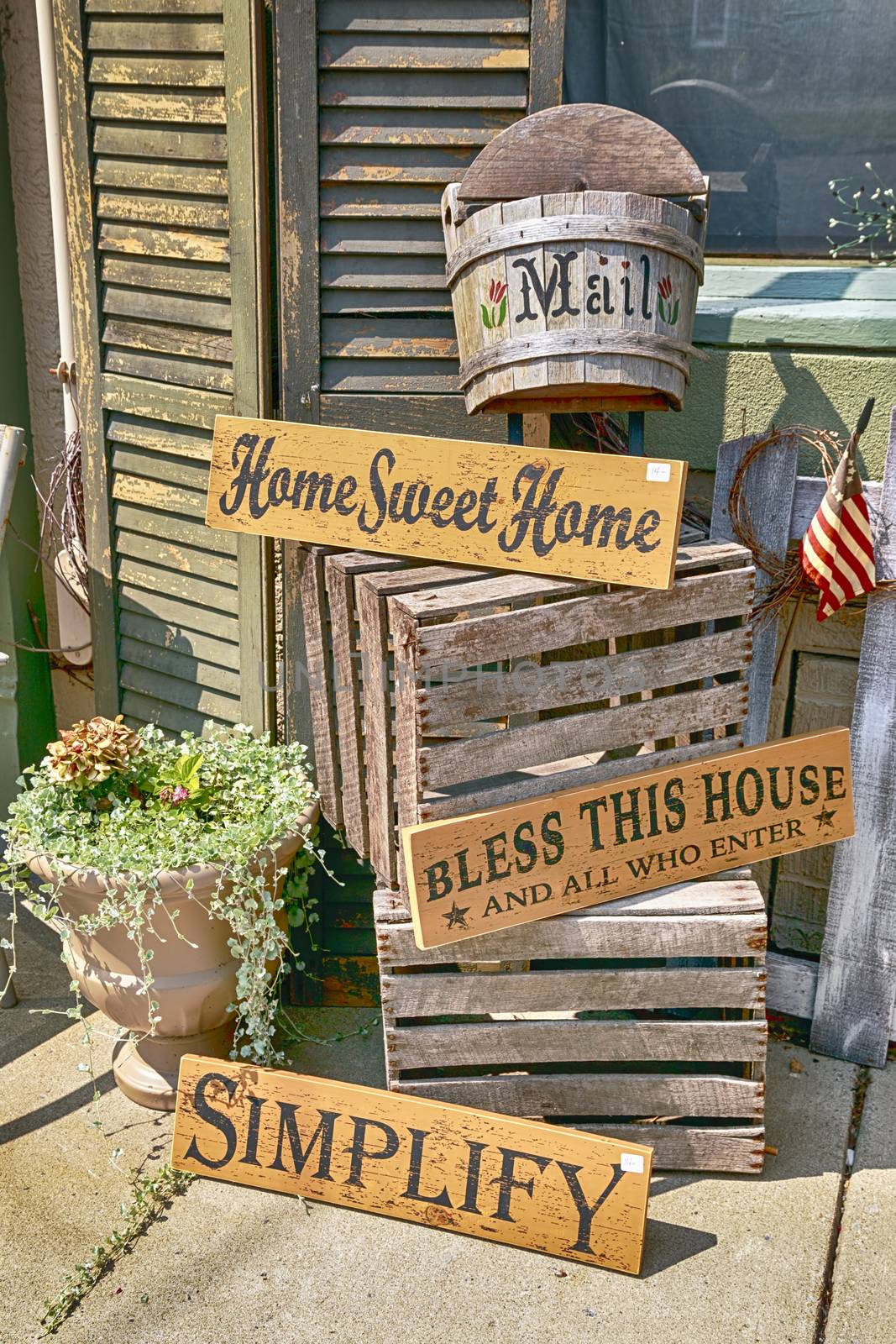 Crafty porch decorative signs in a well thought out display. Home sweet home. Bless this house. 