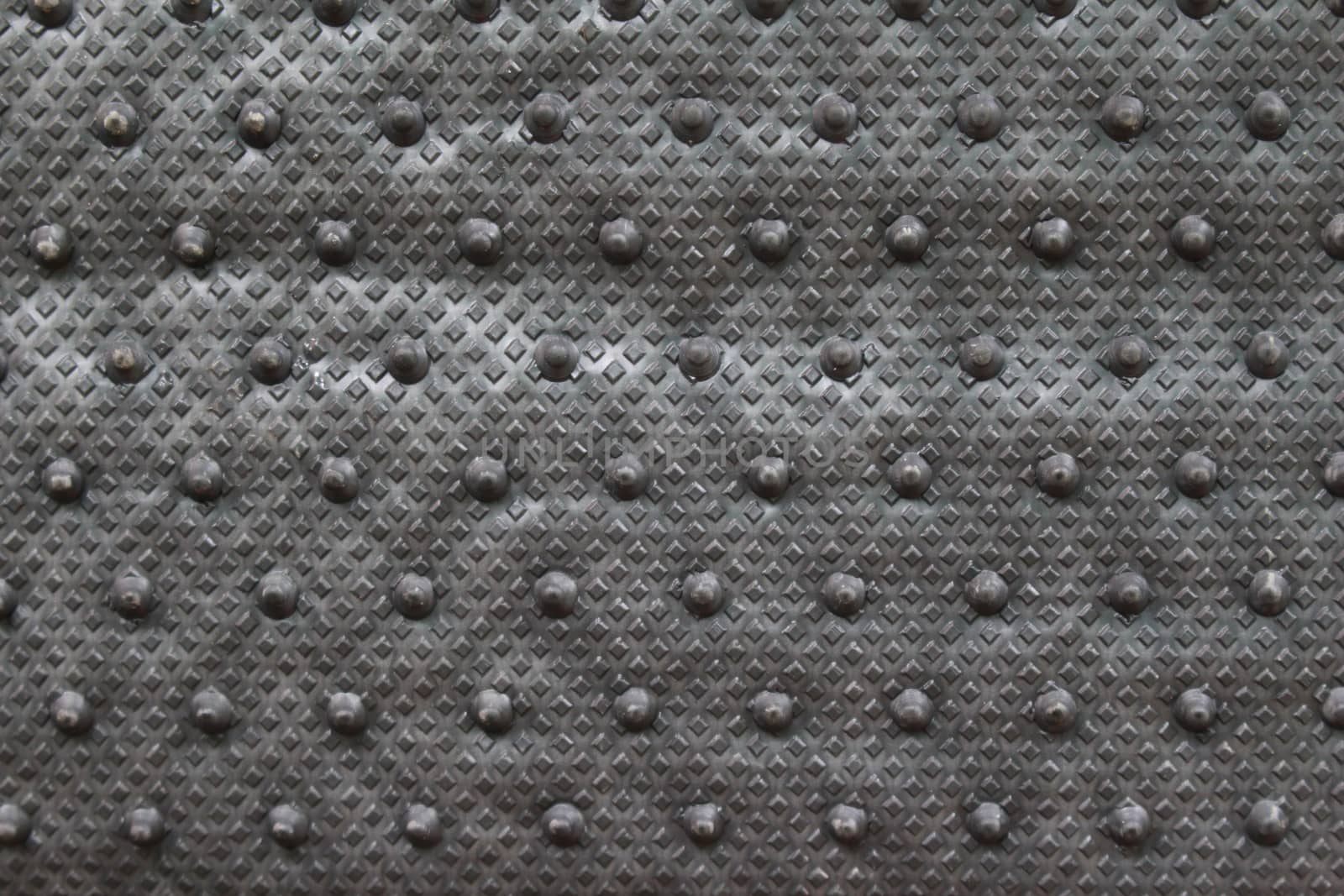 Plastic patterned to prevent slipping.