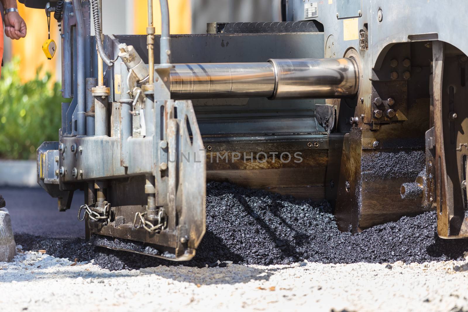 Heavy machiners construction works during asphalting road.