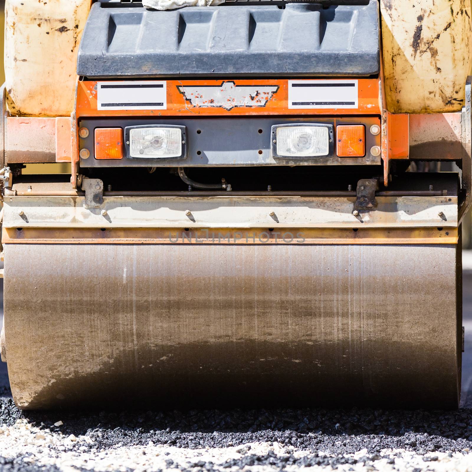 Heavy machiners construction works during asphalting road.